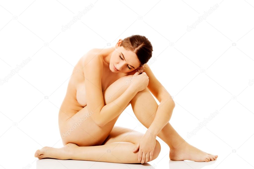 https://st2n.depositphotos.com/1003556/10836/i/950/depositphotos_108361446-stock-photo-young-naked-woman-sitting-on.jpg