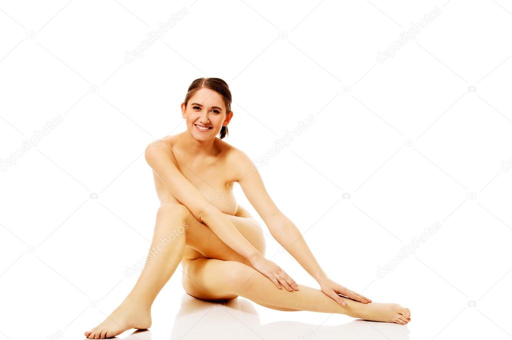 https://st2n.depositphotos.com/1003556/10836/i/950/depositphotos_108362572-stock-photo-young-naked-woman-sitting-on.jpg