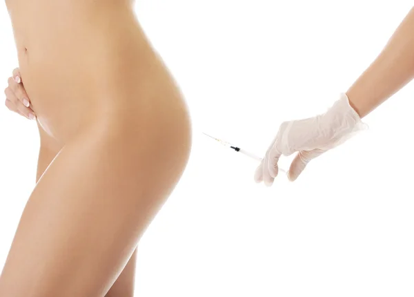 Injection before surgery on a womans bottom — Stock Photo, Image